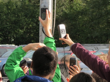Local elementary school students learn to take waypoints on a GPS.